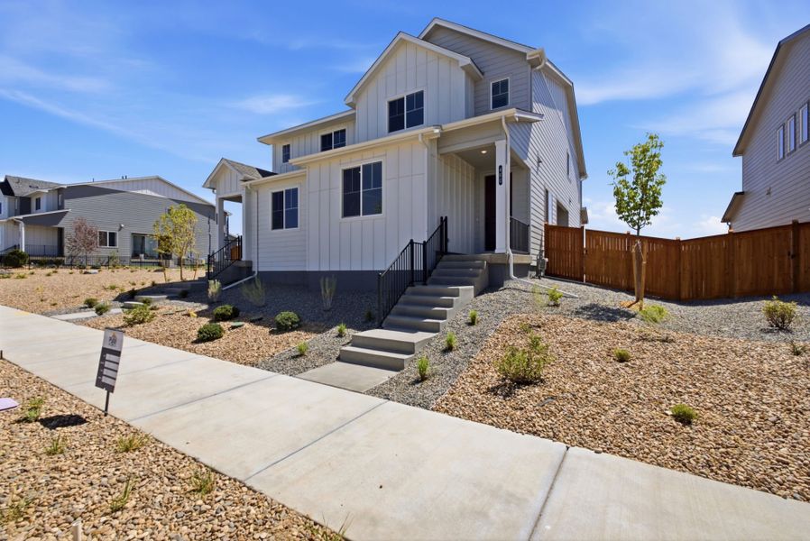 Front exterior of a new home in Sky Ranch, Watkins, CO, highlighting curb appeal (Image 2). Front exterior of a new home in Sky Ranch, Watkins, CO, highlighting curb appeal (Image 2).