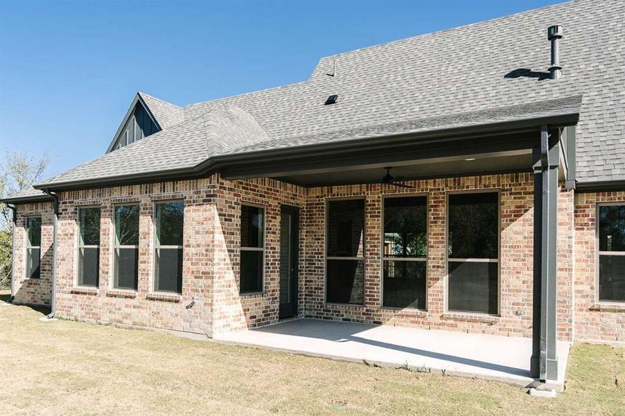 View of side of property featuring a patio