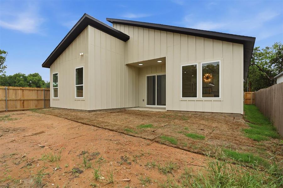 Contemporary exterior featuring vertical siding in contrasting dark and light tones