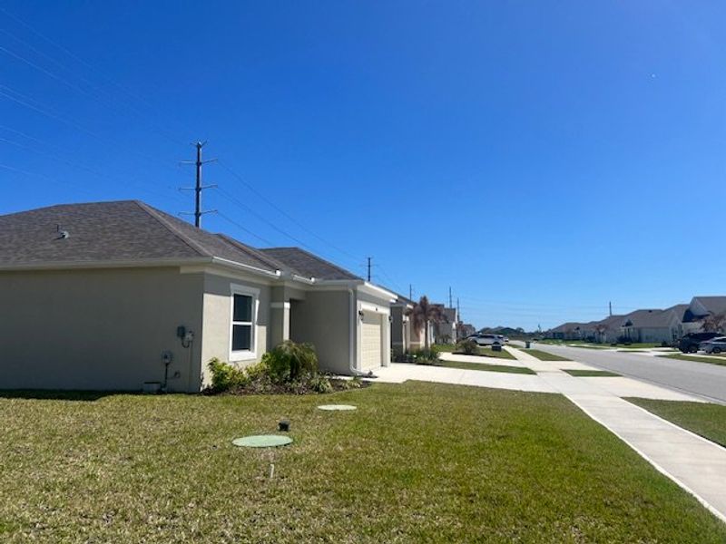 Exterior details and patio area of a home in Lakes At St Sebastian, Micco (Image 22).