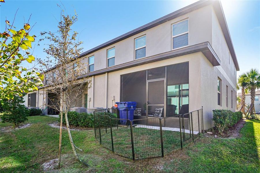 Exterior details and patio area of a home in Bryant Square: The Townes, New Port Richey (Image 23).