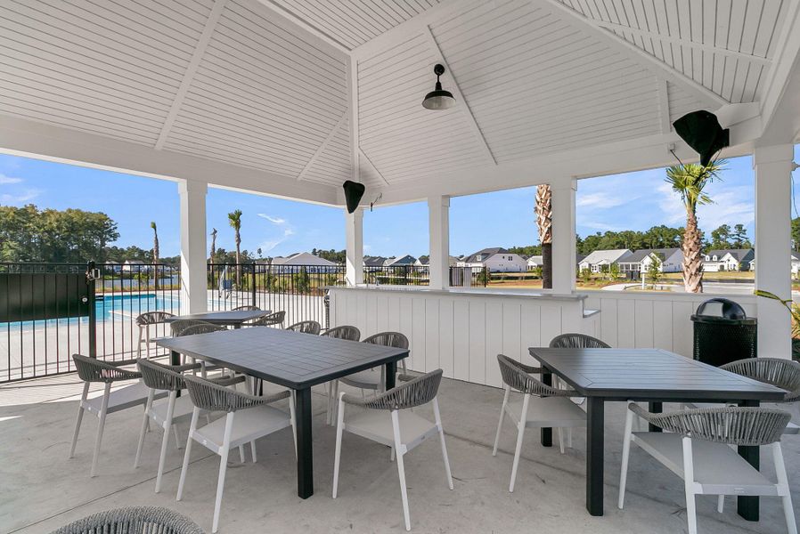 Exterior details and patio area of a home in Summerwind Crossing at Lakes of Cane Bay, Summerville (Image 25).