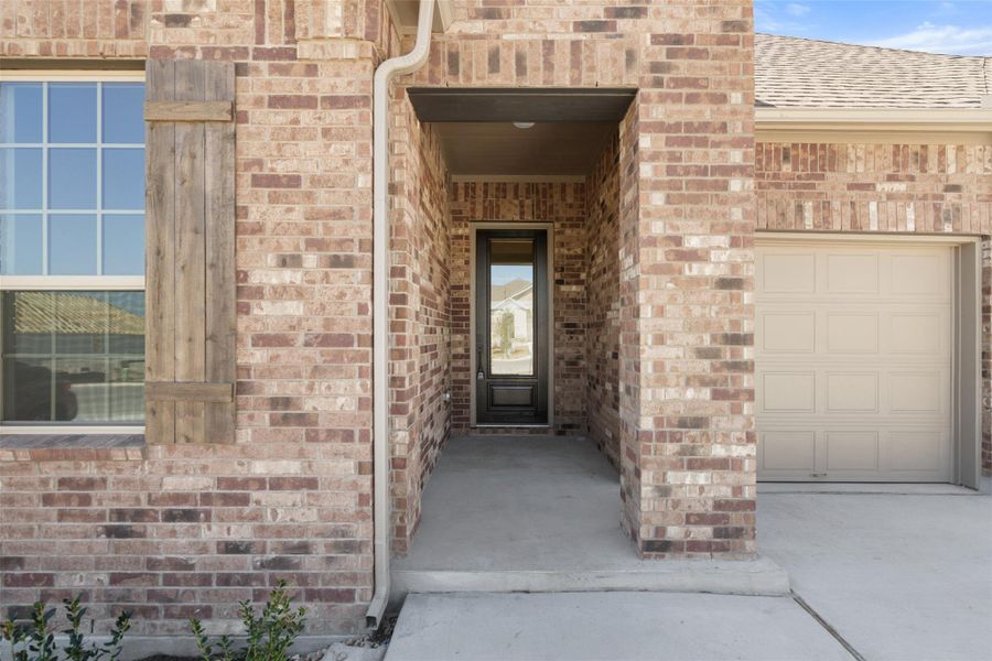 Exterior details and patio area of a home in The Trails at Carmel, Pflugerville (Image 24).