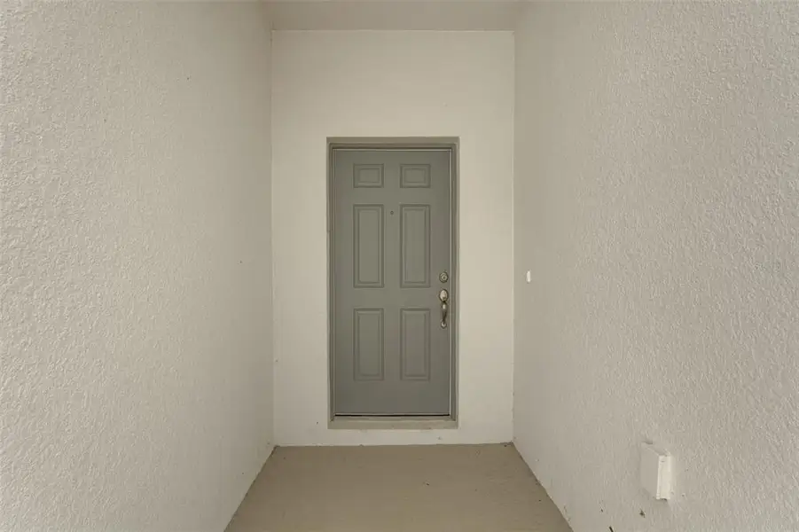 Exterior details and patio area of a home in Cypress Park Estates, Haines City (Image 4).