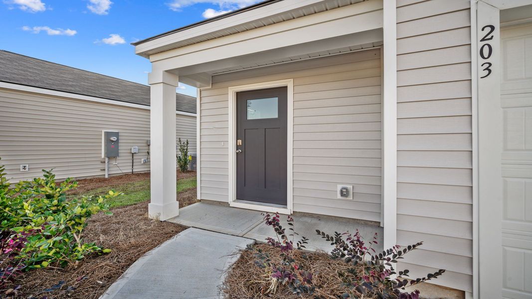 Exterior details and patio area of a home in The Groves at Bees Creek, Ridgeland (Image 3).