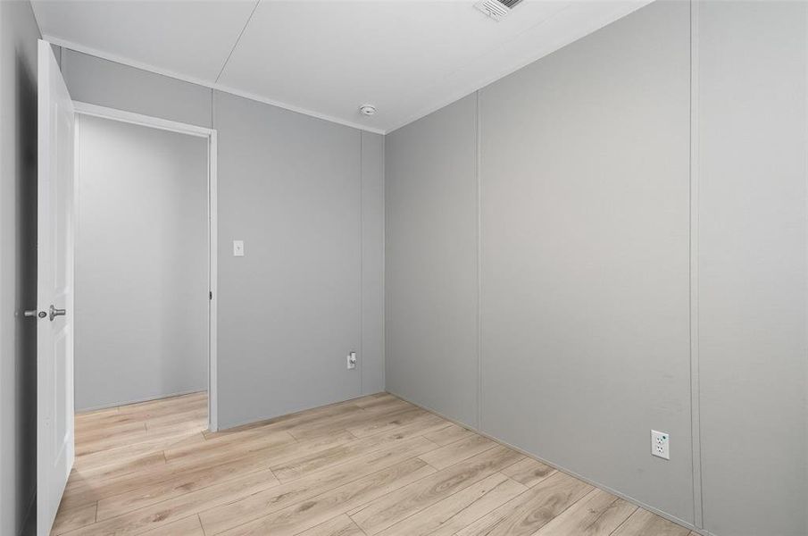 Spare room featuring light wood-style flooring Spare room featuring light wood-style flooring