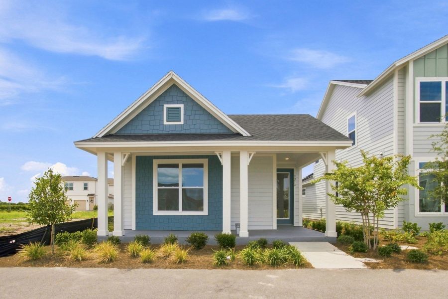 Front exterior of a new home in Weslyn Park in Sunbridge 34', St. Cloud, FL, highlighting curb appeal (Image 2). Front exterior of a new home in Weslyn Park in Sunbridge 34', St. Cloud, FL, highlighting curb appeal (Image 2).