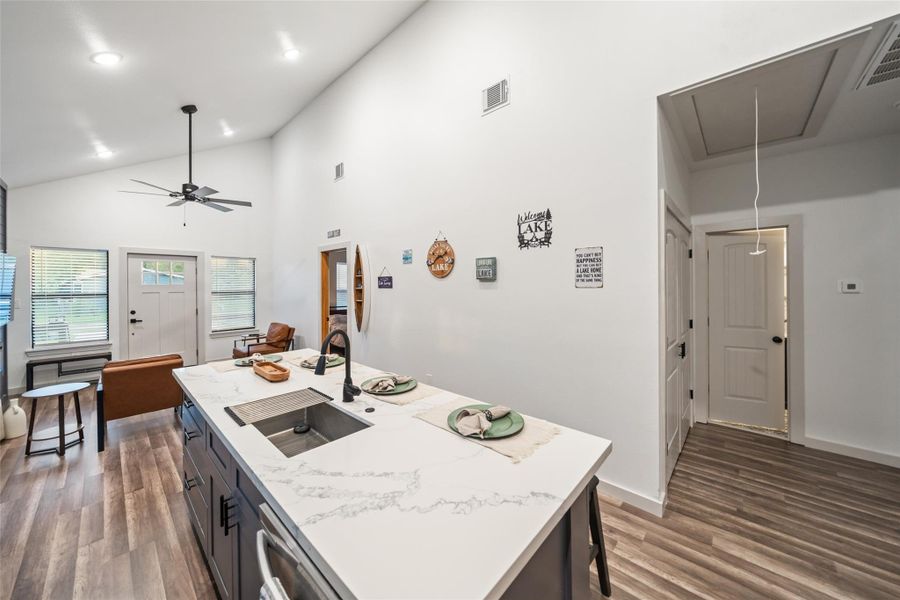 Exiting the kitchen to access the double doors to the laundry room; or to access the 2nd full bathroom