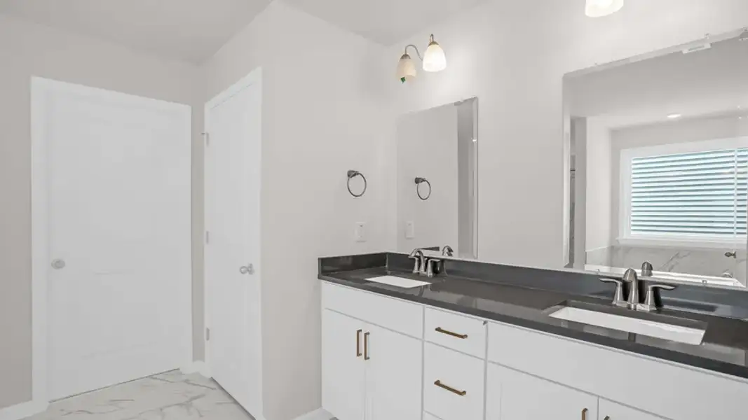 Furnished interior view inside a new home in The Estates Park, Apex (Image 11).