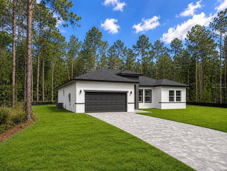 Front exterior of a new home in , Ocala, FL, highlighting curb appeal (Image 21). Front exterior of a new home in , Ocala, FL, highlighting curb appeal (Image 21).