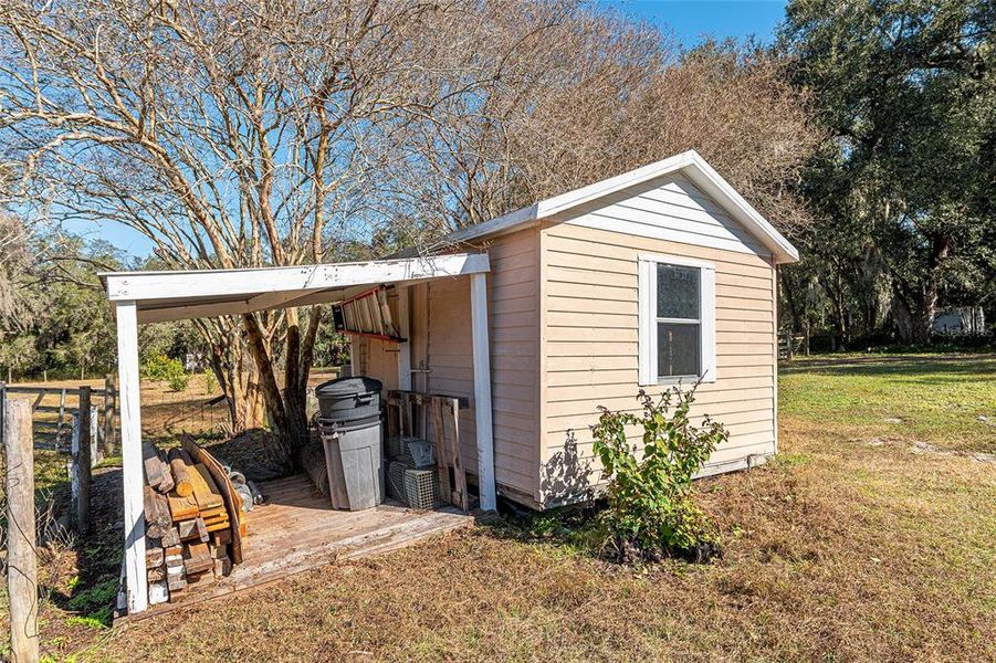 Exterior details and patio area of a home in , Weirsdale (Image 19).