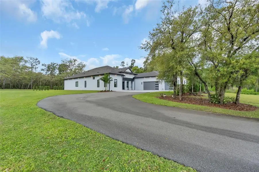 Front exterior of a new home in , Kissimmee, FL, highlighting curb appeal (Image 2). Front exterior of a new home in , Kissimmee, FL, highlighting curb appeal (Image 2).