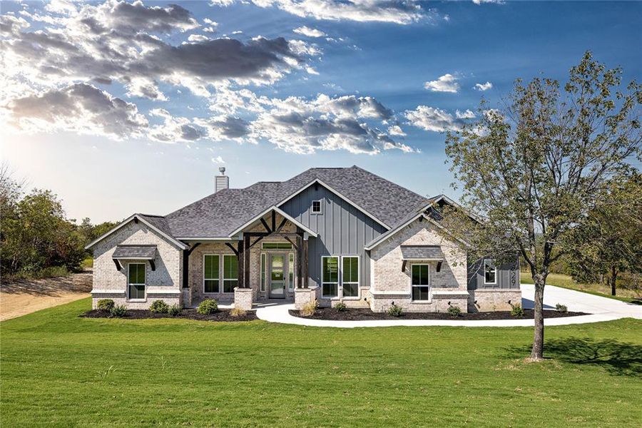 View of front of property with a front yard