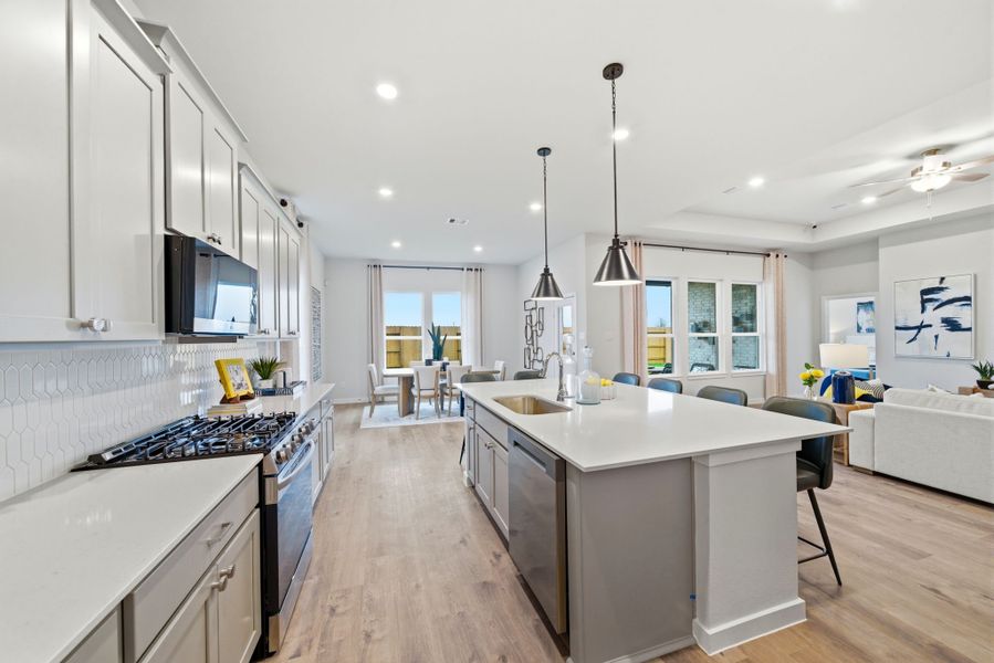 A kitchen with white cabinets. A kitchen with white cabinets.
