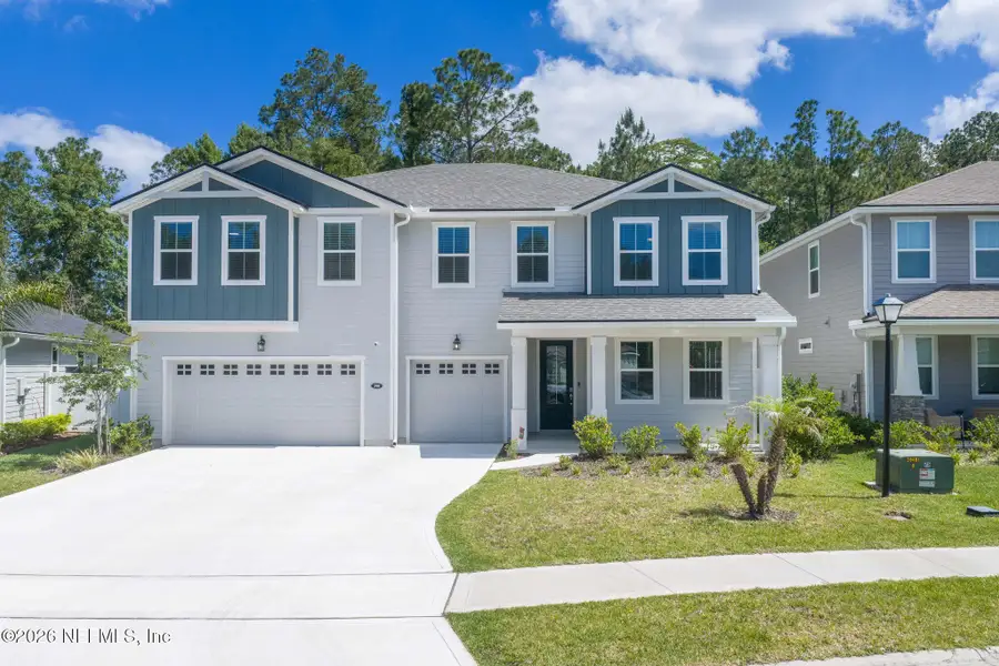 Front exterior of a new home in RiverTown - Settlement, St. Johns, FL, highlighting curb appeal (Image 1). Front exterior of a new home in RiverTown - Settlement, St. Johns, FL, highlighting curb appeal (Image 1).