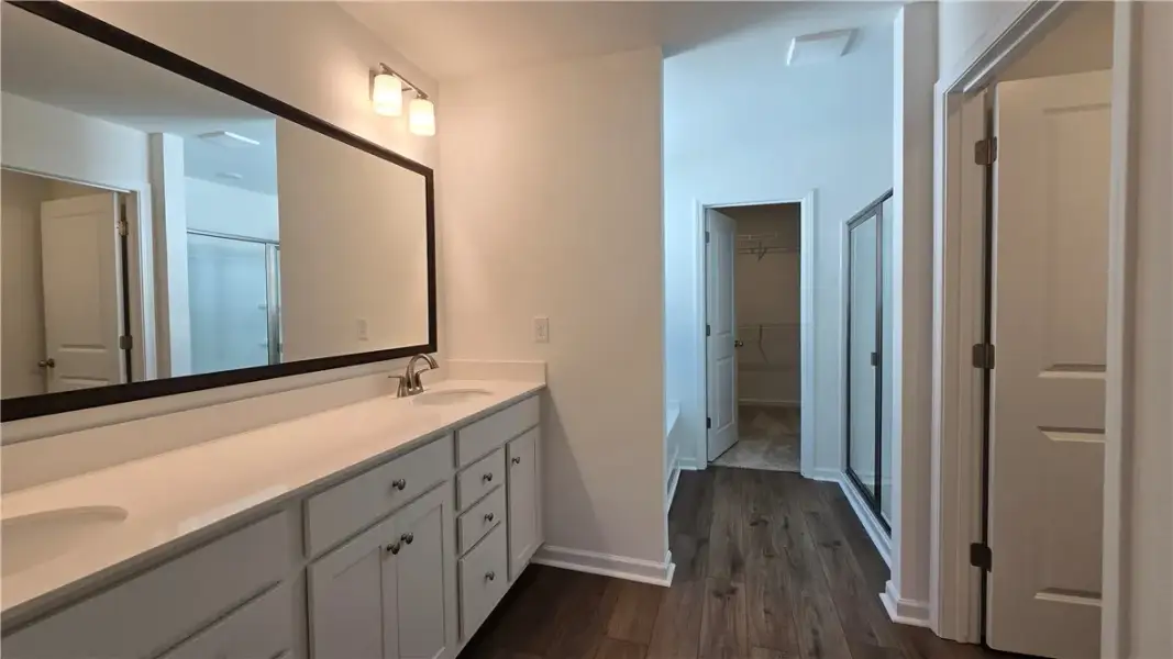 Gleaming wood flooring complements a long double v