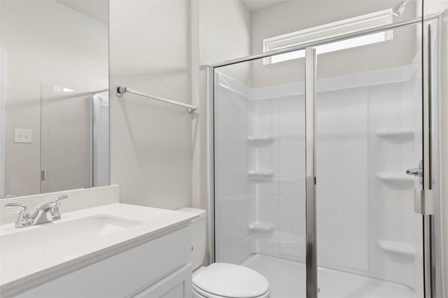 Bathroom with vanity and a stall shower
