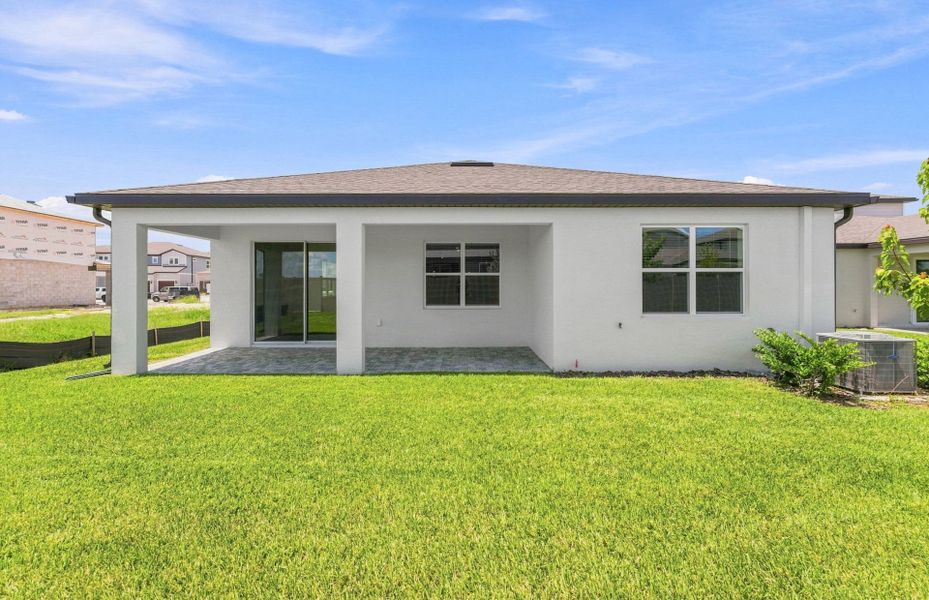 Exterior details and patio area of a home in Vida's Way, Wesley Chapel (Image 4).