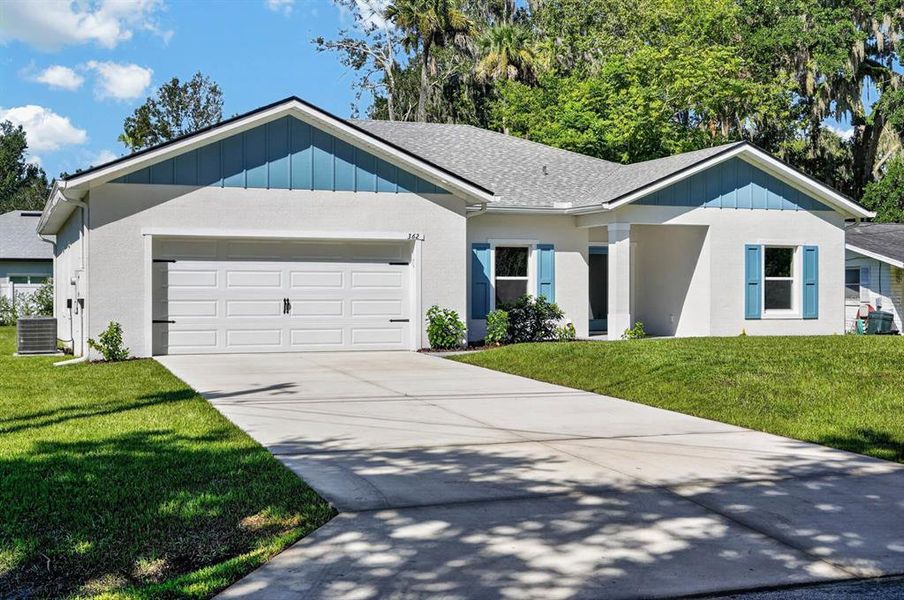 Front exterior of a new home in , New Smyrna Beach, FL, highlighting curb appeal (Image 22).