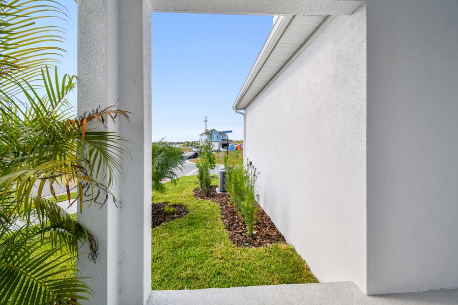 Exterior details and patio area of a home in Emerald Landing at Waterside at Lakewood Ranch – Cottage Series, Sarasota (Image 4).