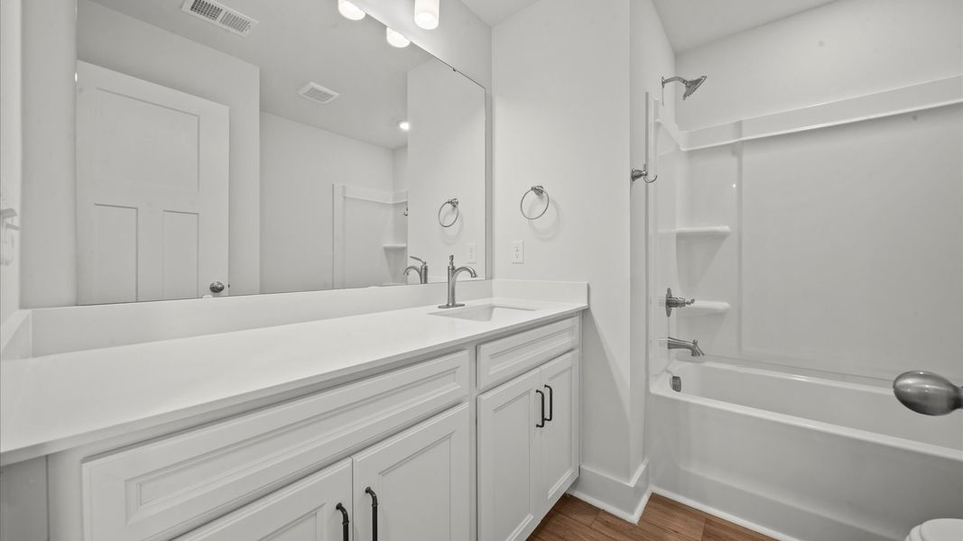 Elegant full bathroom with tasteful finishes and a thoughtfully designed layout