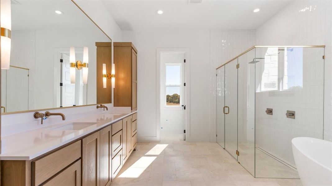 Bathroom featuring plus walk in shower and vanity