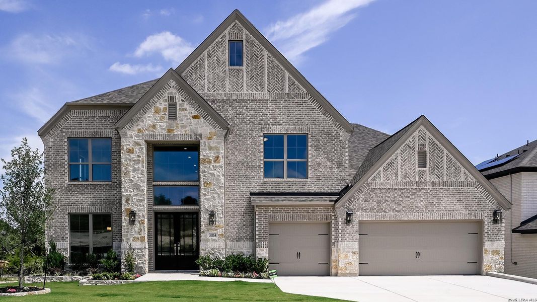 Front exterior of a new home in Johnson Ranch, Bulverde, TX, highlighting curb appeal (Image 1). Front exterior of a new home in Johnson Ranch, Bulverde, TX, highlighting curb appeal (Image 1).