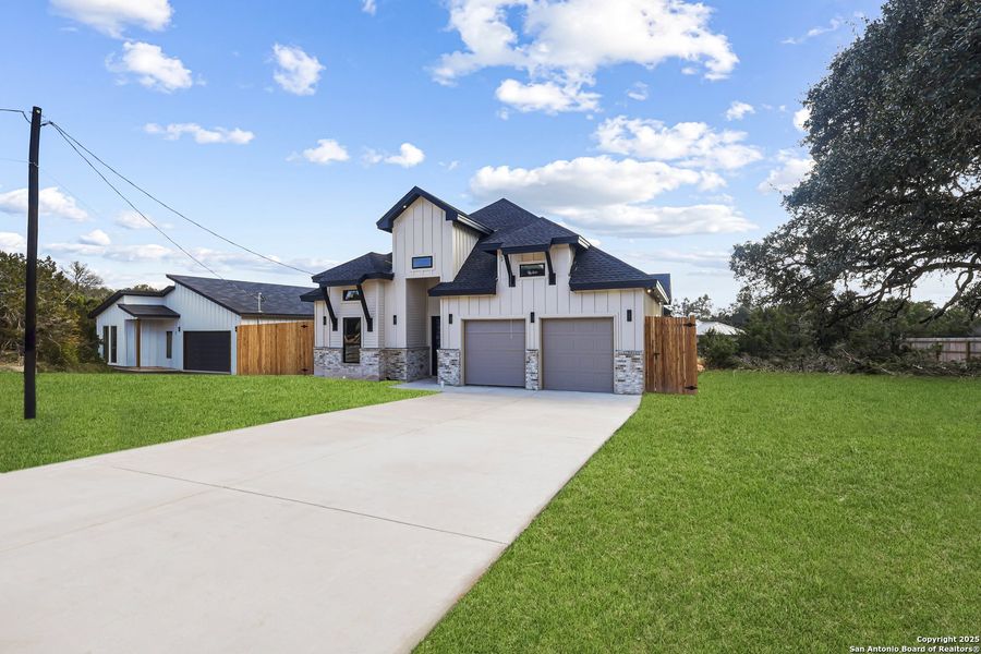 Front exterior of a new home in , Spring Branch, TX, highlighting curb appeal (Image 19).