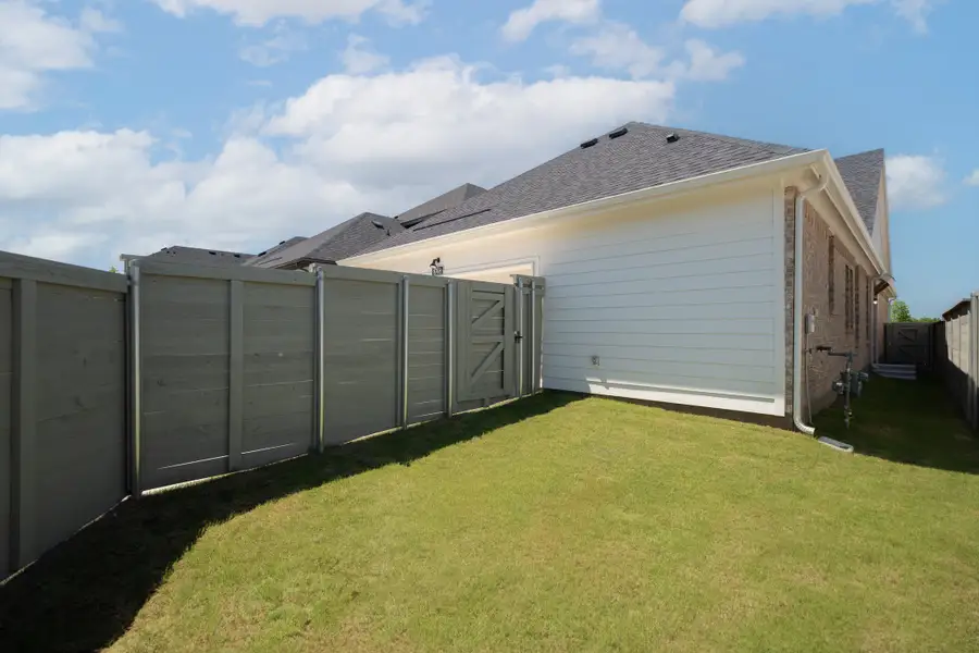 Exterior details and patio area of a home in Treeline, Justin (Image 2). Exterior details and patio area of a home in Treeline, Justin (Image 2).