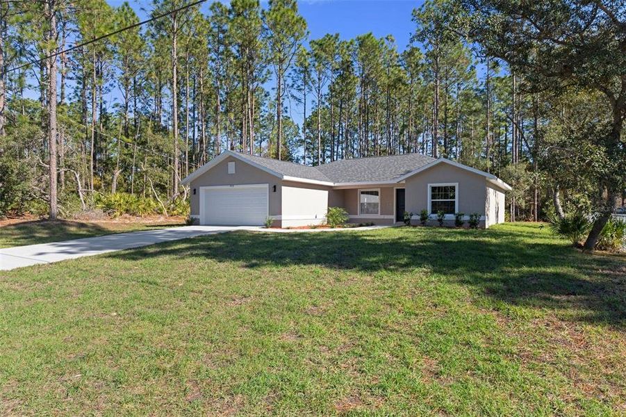 Front exterior of a new home in , Citrus Springs, FL, highlighting curb appeal (Image 2).