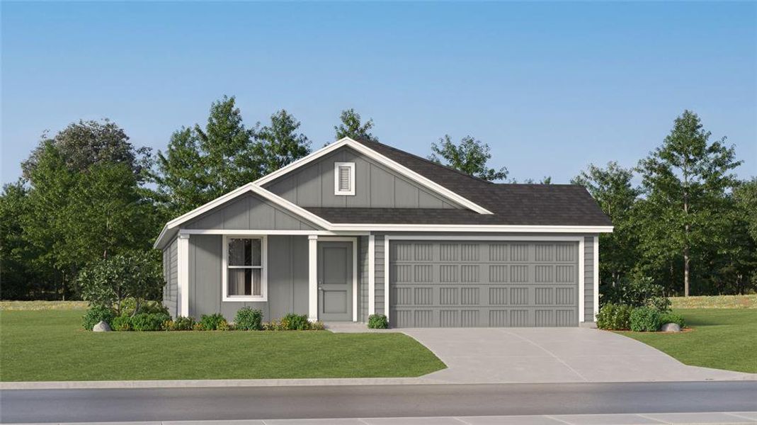 View of front of property with a garage and a front lawn