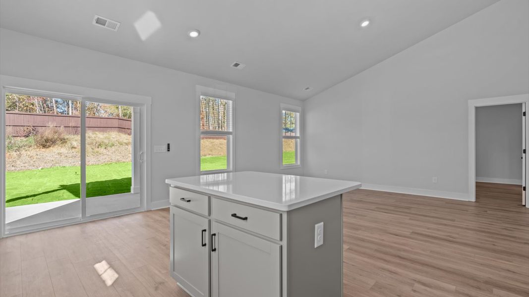 Superior craftsmanship shines in this modern kitchen with a space-saving island and open flow