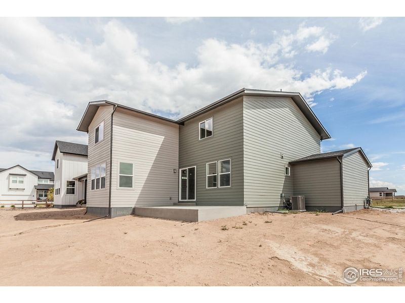 Exterior details and patio area of a home in Trailside Story Collection - Single Family Homes, Timnath (Image 24).