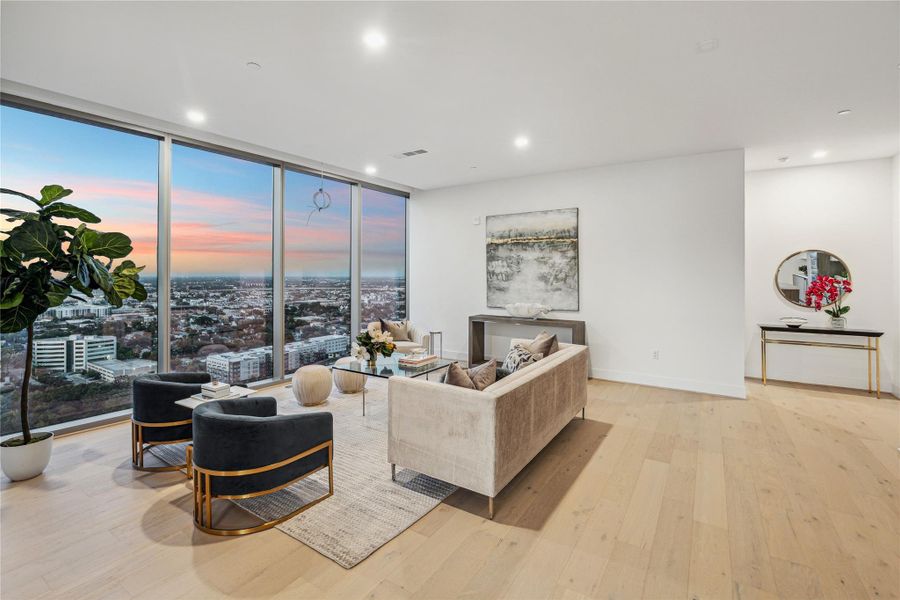 Expansive open living area with natural light and framed by stunning views. Expansive open living area with natural light and framed by stunning views.