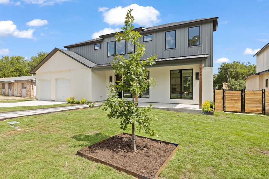 Modern farmhouse style home featuring driveway, a garage, and a metal roof Modern farmhouse style home featuring driveway, a garage, and a metal roof