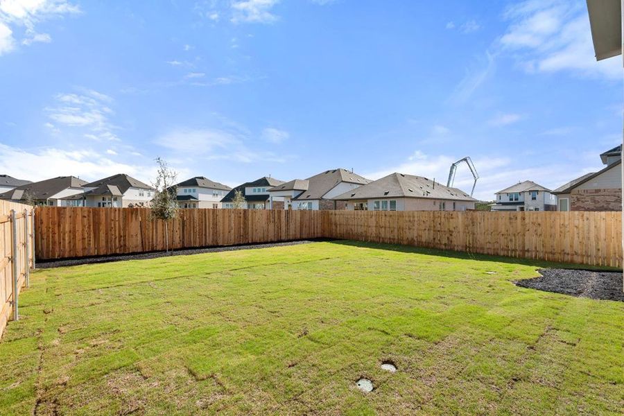 Exterior details and patio area of a home in Heritage, Dripping Springs (Image 21).