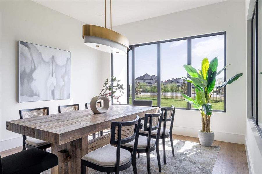 Dining area with hardwood / wood-style flooring