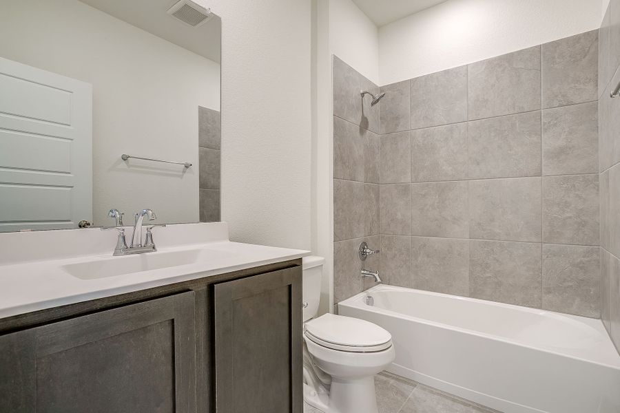 Representative furnished interior of a home built from the Palmer by Graham Hart Home Builder in Bear Ridge, Burleson (Image 12).