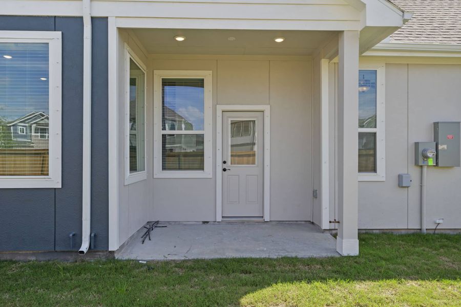 Exterior details and patio area of a home in Meridiana, Manvel (Image 3).