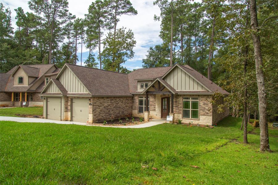 Another view of the brick and stone exterior. This is not the actual home, but a picture of a previously built home in the area. Another view of the brick and stone exterior. This is not the actual home, but a picture of a previously built home in the area.