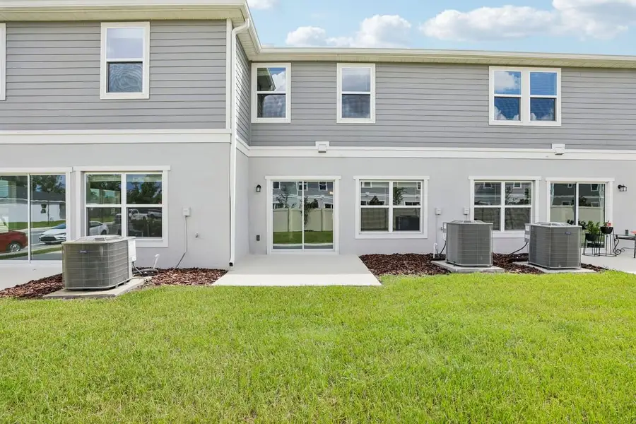 Exterior details and patio area of a home in Reserve at Forest Lake Townhomes, Lake Wales (Image 4). Exterior details and patio area of a home in Reserve at Forest Lake Townhomes, Lake Wales (Image 4).