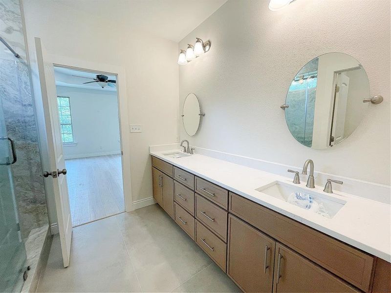 Primary bathroom with a double vanity sink, and modern touches