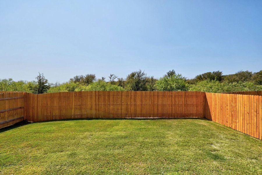 Exterior details and patio area of a home in Trinity Ranch, Elgin (Image 23).