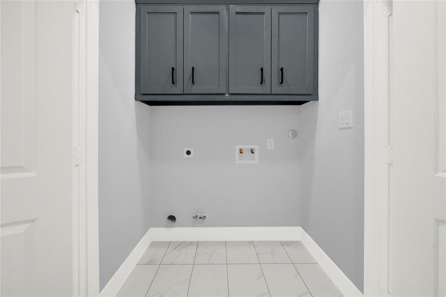 Extra cabinet storage space in laundry closet