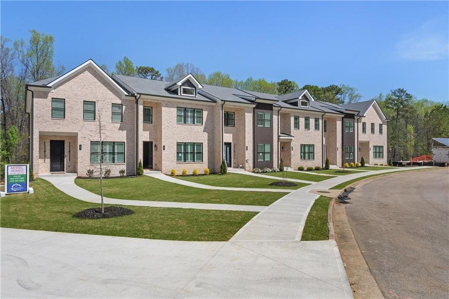 Front exterior of a new home in , Stockbridge, GA, highlighting curb appeal (Image 2).