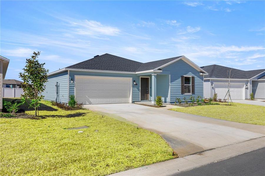 Front exterior of a new home in Marion Ranch, Ocala, FL, highlighting curb appeal (Image 2).