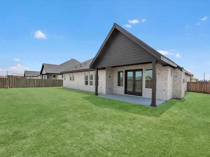 The space in this backyard is umatched! Large covered patio, 4 Sides Bricked, and ample yard space! The space in this backyard is umatched! Large covered patio, 4 Sides Bricked, and ample yard space!