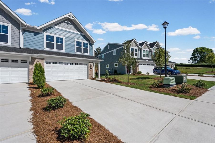 Front exterior of a new home in Villas at Gold Creek, Dawsonville, GA, highlighting curb appeal (Image 21). Front exterior of a new home in Villas at Gold Creek, Dawsonville, GA, highlighting curb appeal (Image 21).