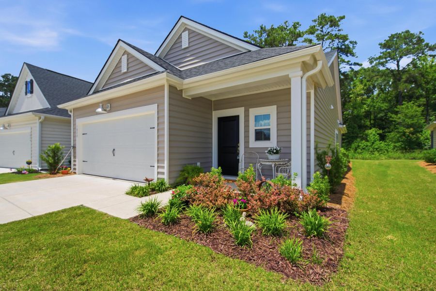 Front exterior of a new home in Horizons at Summers Corner | 55+, Summerville, SC, highlighting curb appeal (Image 25).