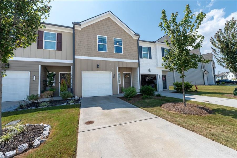 Front exterior of a new home in , Hoschton, GA, highlighting curb appeal (Image 18).